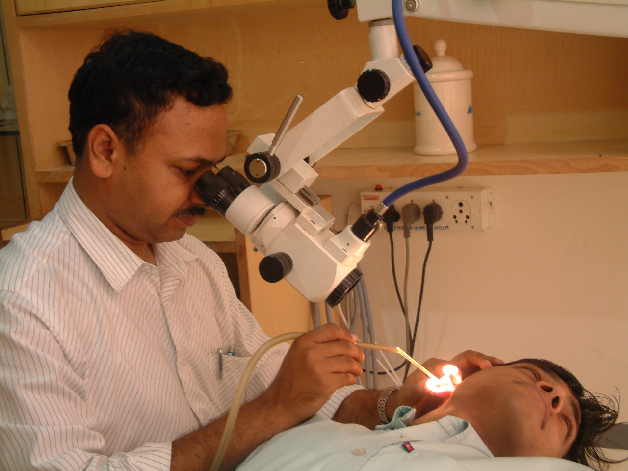 Ajay working with Microscope